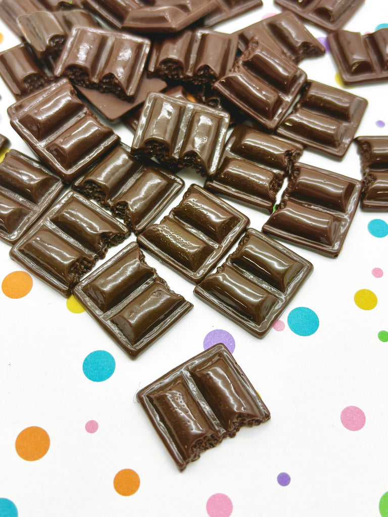 a pile of chocolate pieces sitting on top of a table