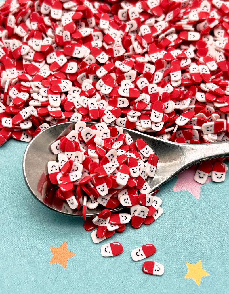a spoon full of red and white hearts