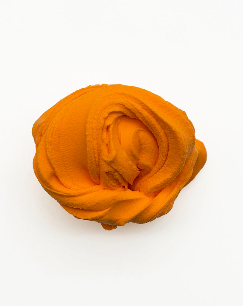 A single, orange-colored object is shown against a white background.