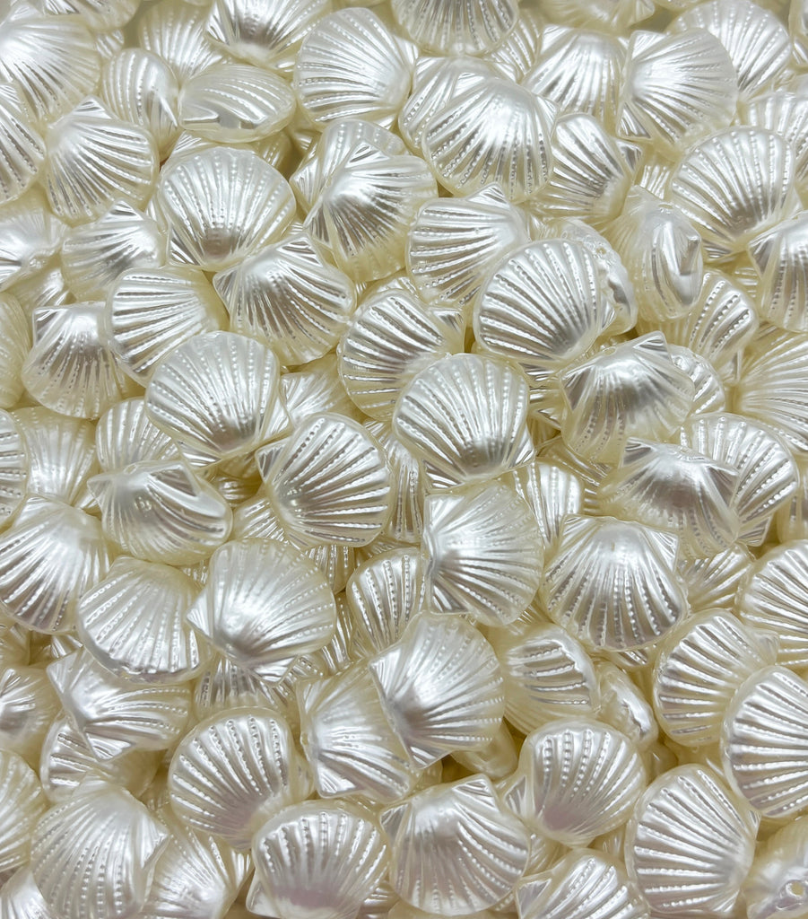 a pile of white shells sitting on top of a table