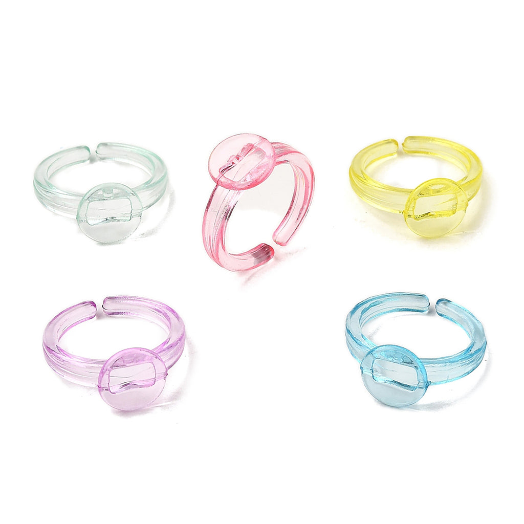 five colorful plastic rings, each with a unique design and color.