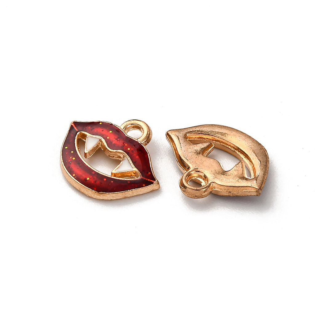 two gold-colored charms, one with a red enamel design and the other with a gold-colored design.