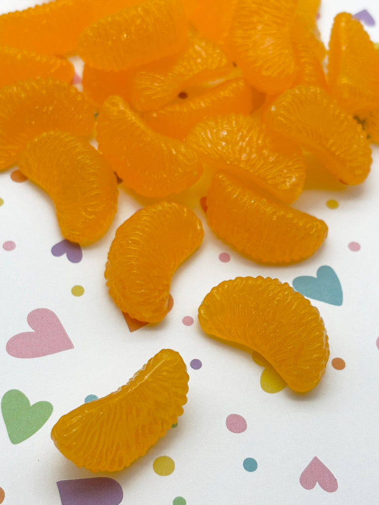 a pile of orange slices sitting on top of a table