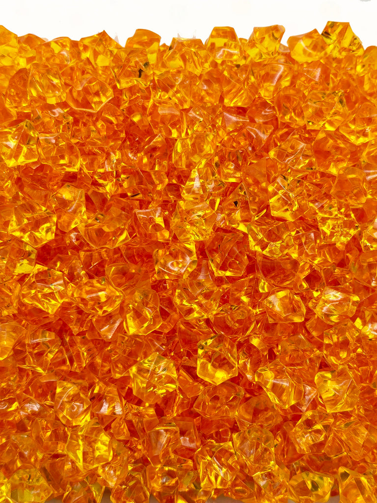 a close up of a yellow glass object