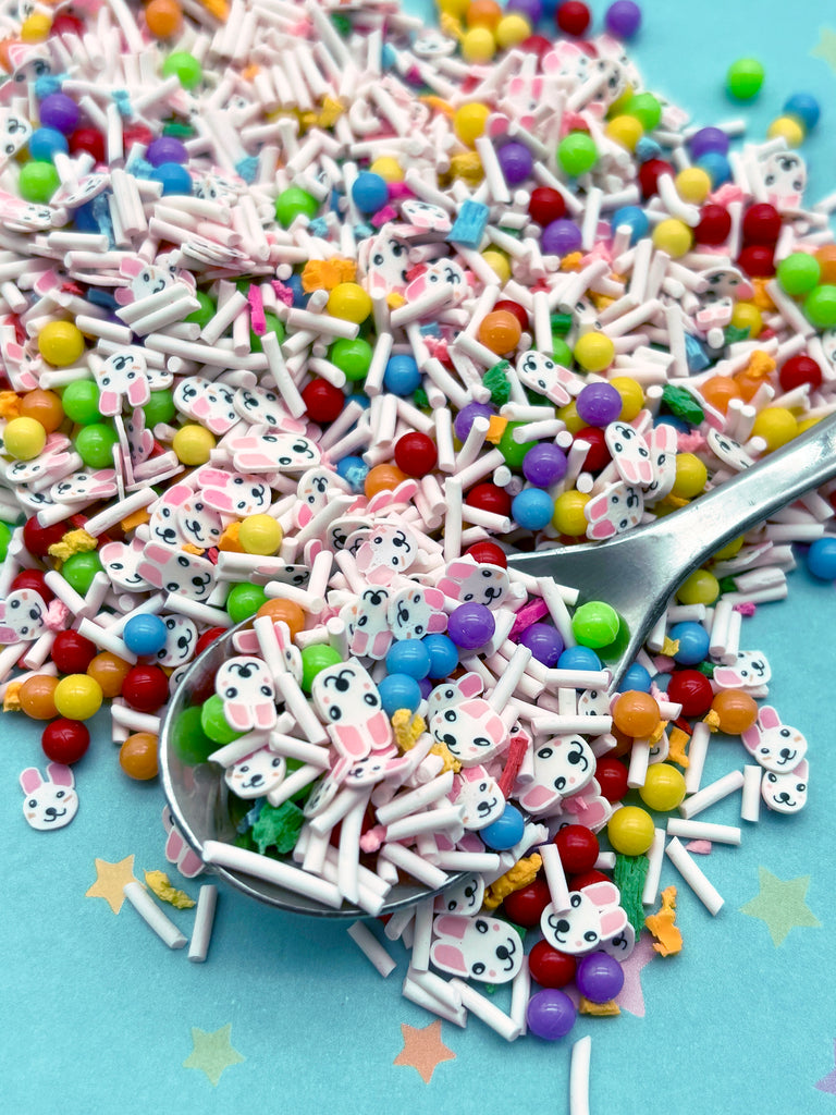 a spoon filled with lots of colorful candies