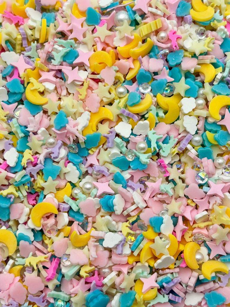 a pile of confetti with stars and moon shapes