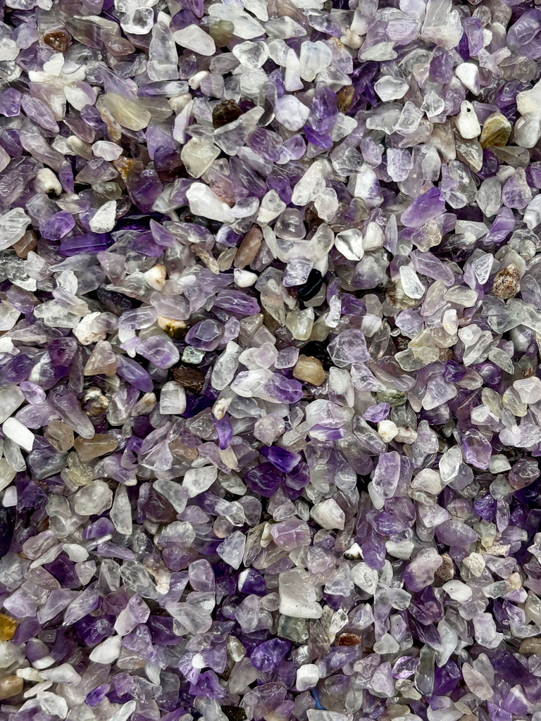 a pile of purple and white rocks and gravel