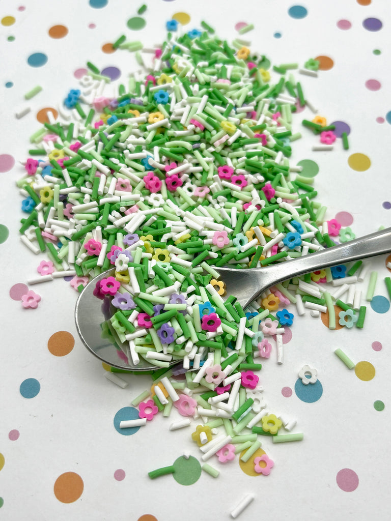 a spoon full of sprinkles on a table