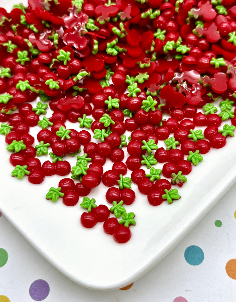 a white plate topped with lots of red and green sprinkles