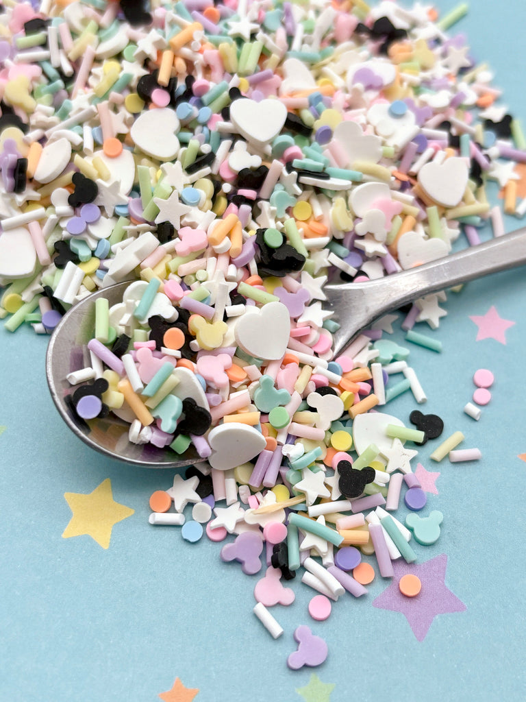 a spoon full of sprinkles on a table