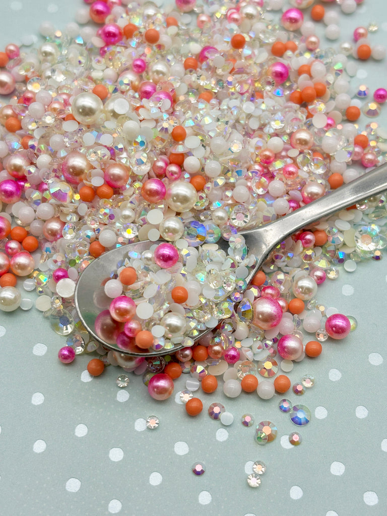 a spoon is sitting on a pile of beads