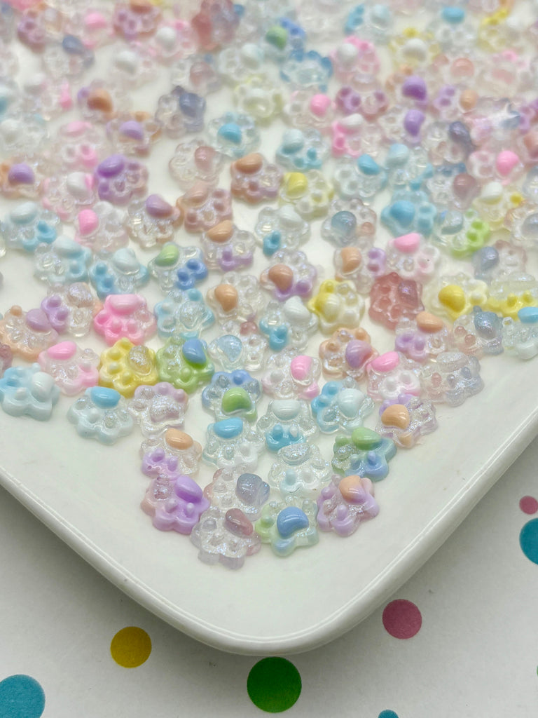 a white plate topped with lots of colorful beads