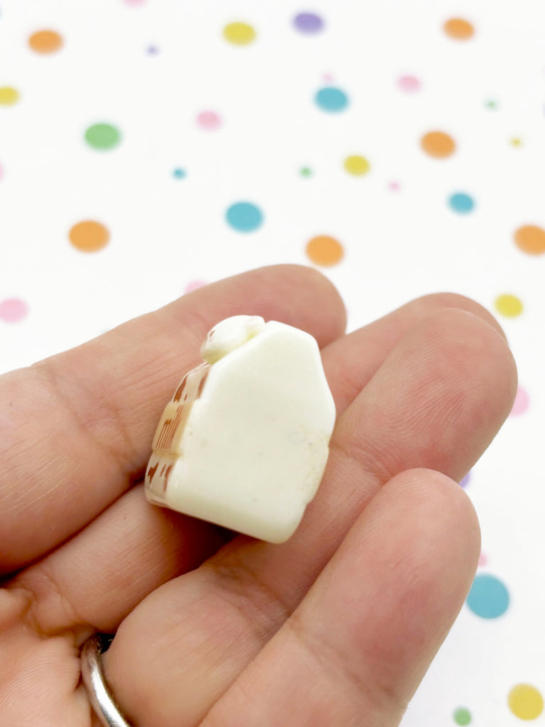 a person holding a piece of food in their hand