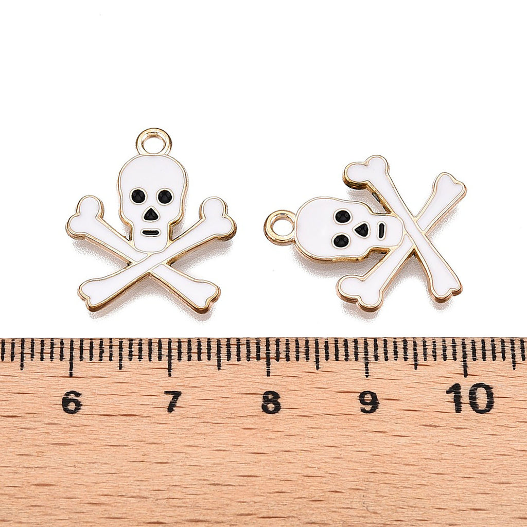 a pair of skull and crossbones charms on a ruler