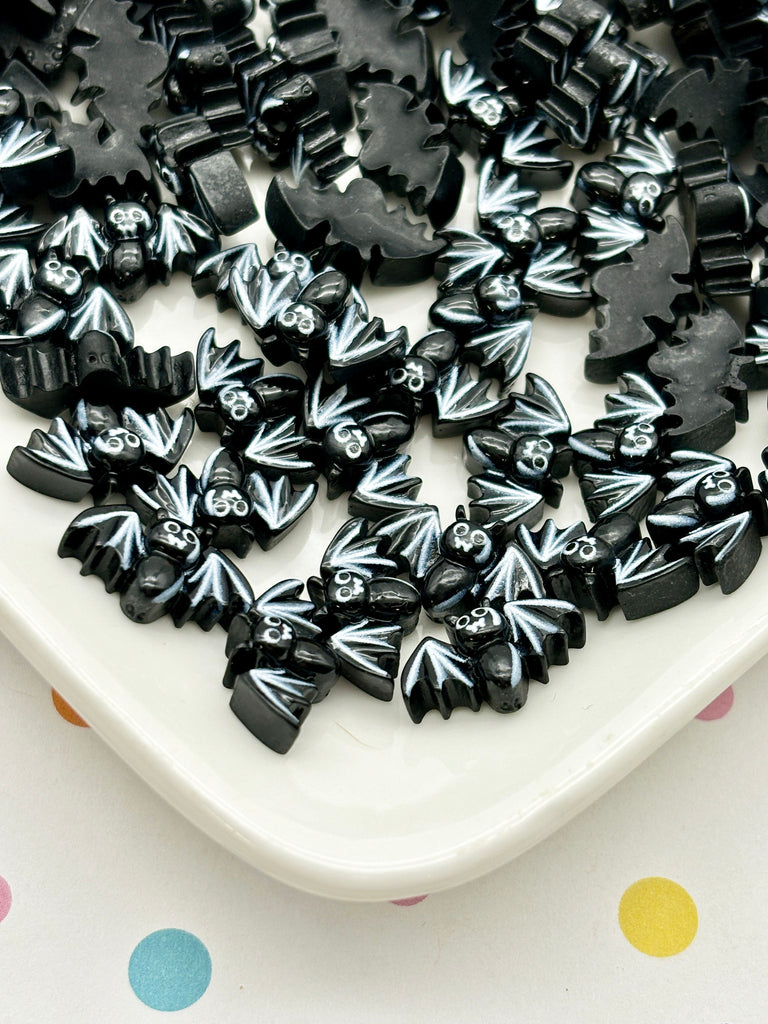 a white plate topped with lots of black bows