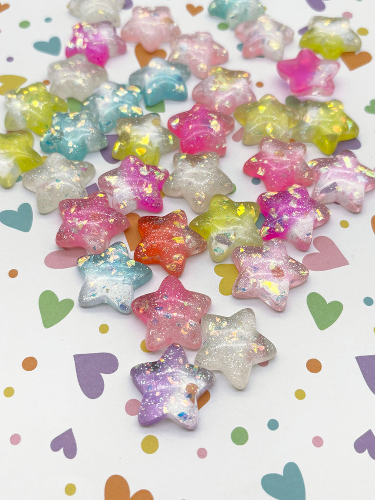 a bunch of little star shaped candies on a table