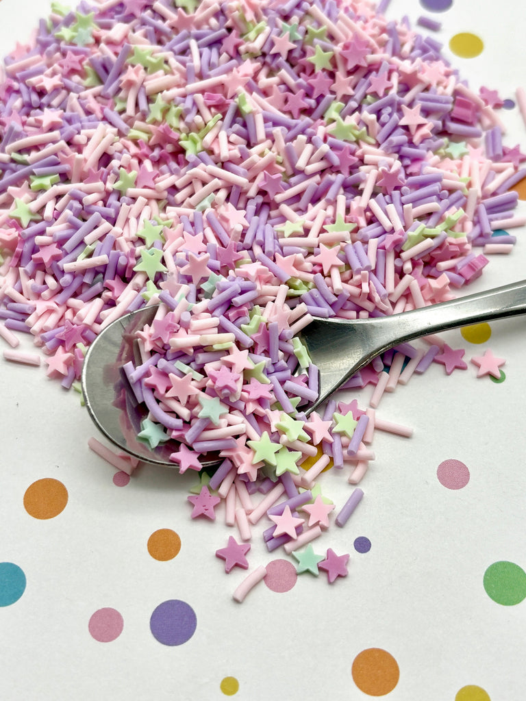 a spoon full of sprinkles on a table