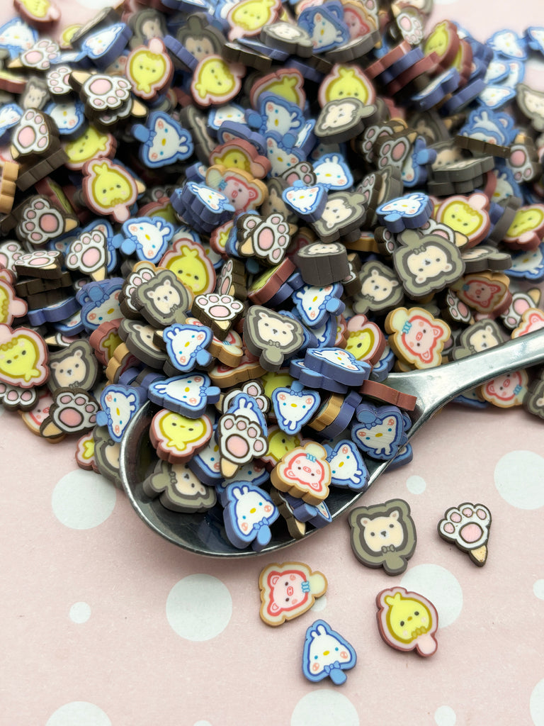 a spoon full of buttons sitting on top of a table