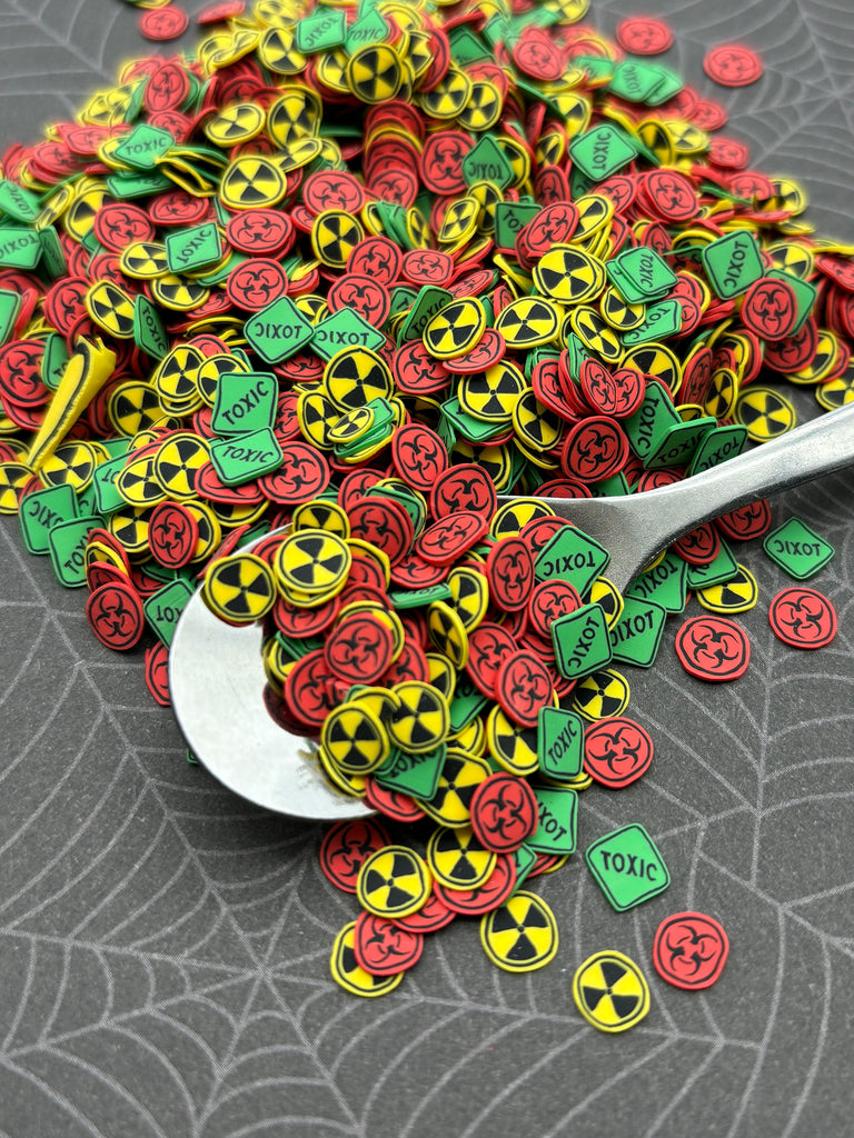 a spoon full of buttons sitting on a table