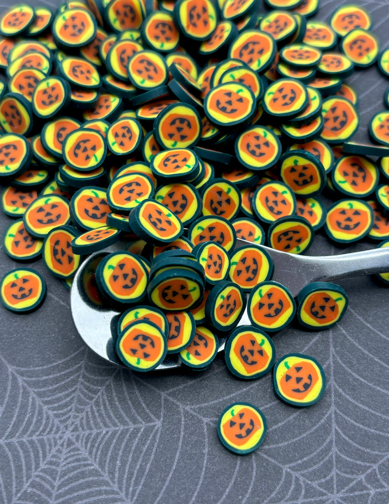 a spoon full of buttons sitting on top of a table