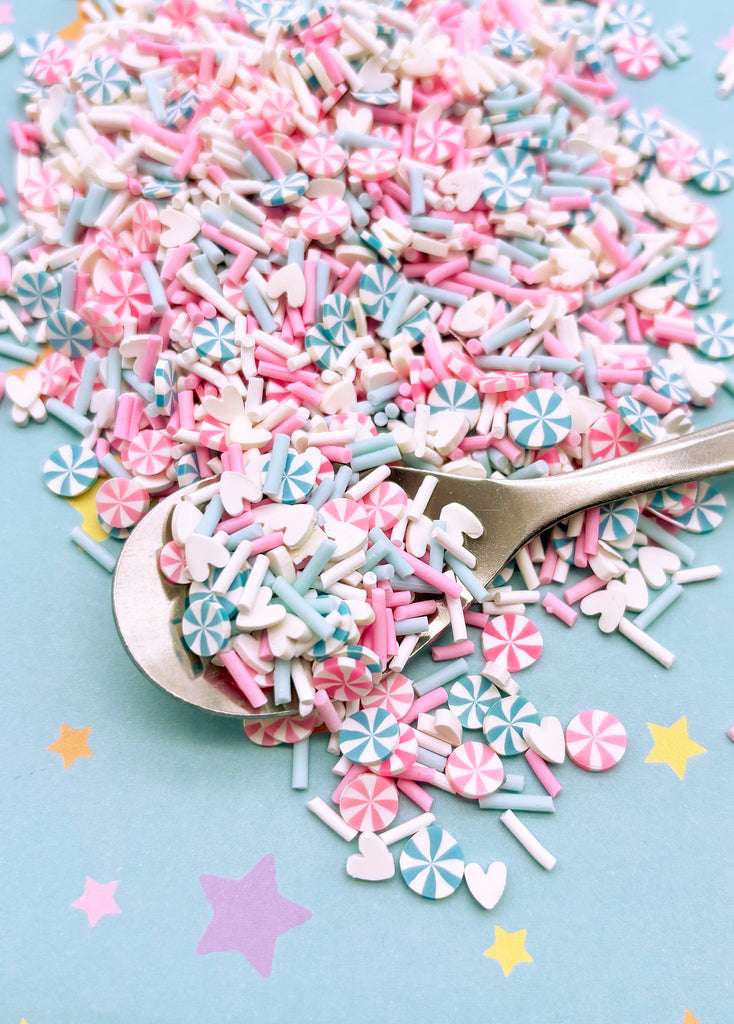 a spoon full of sprinkles on a table