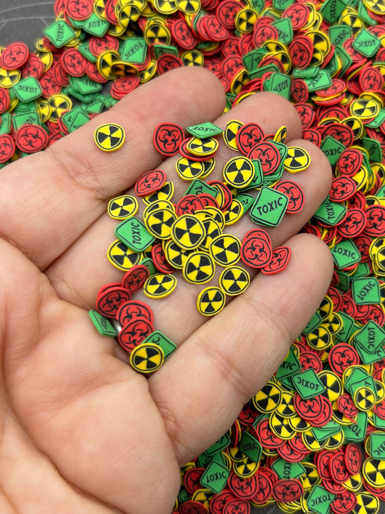 a hand holding a bunch of colorful buttons