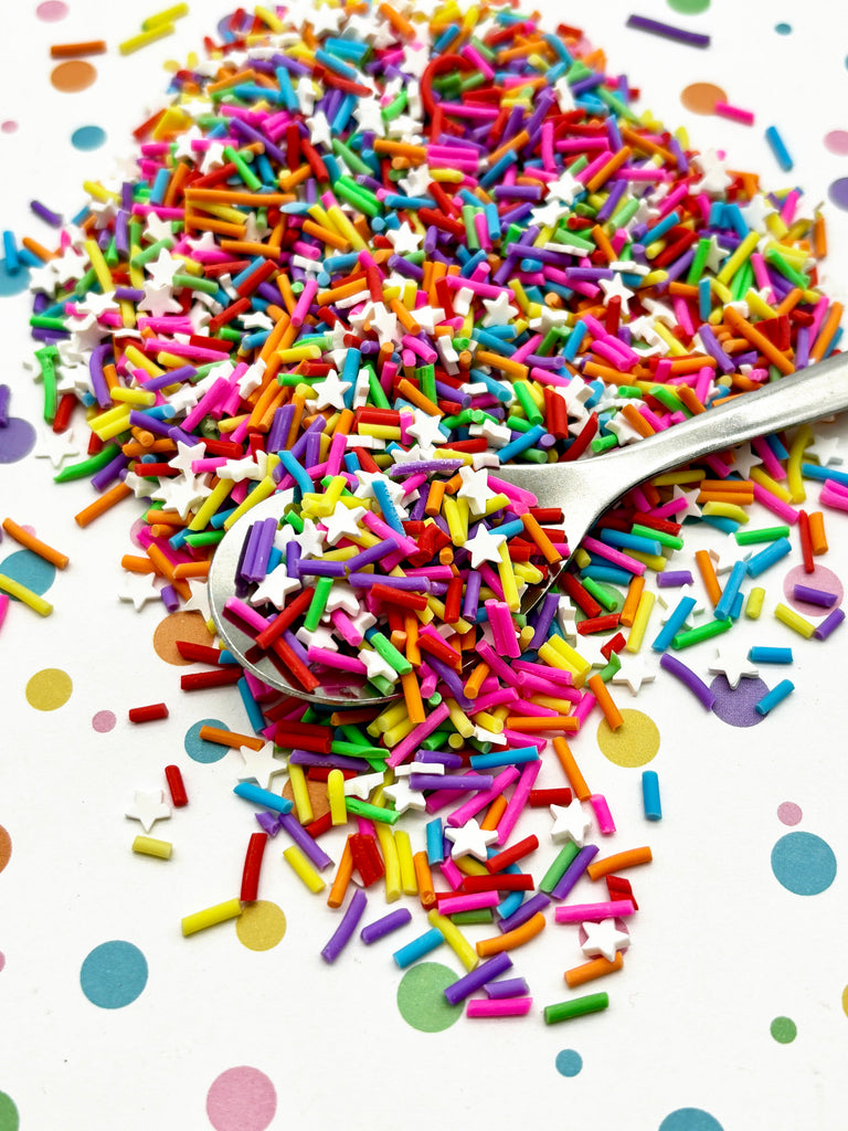 a spoon full of sprinkles on a table