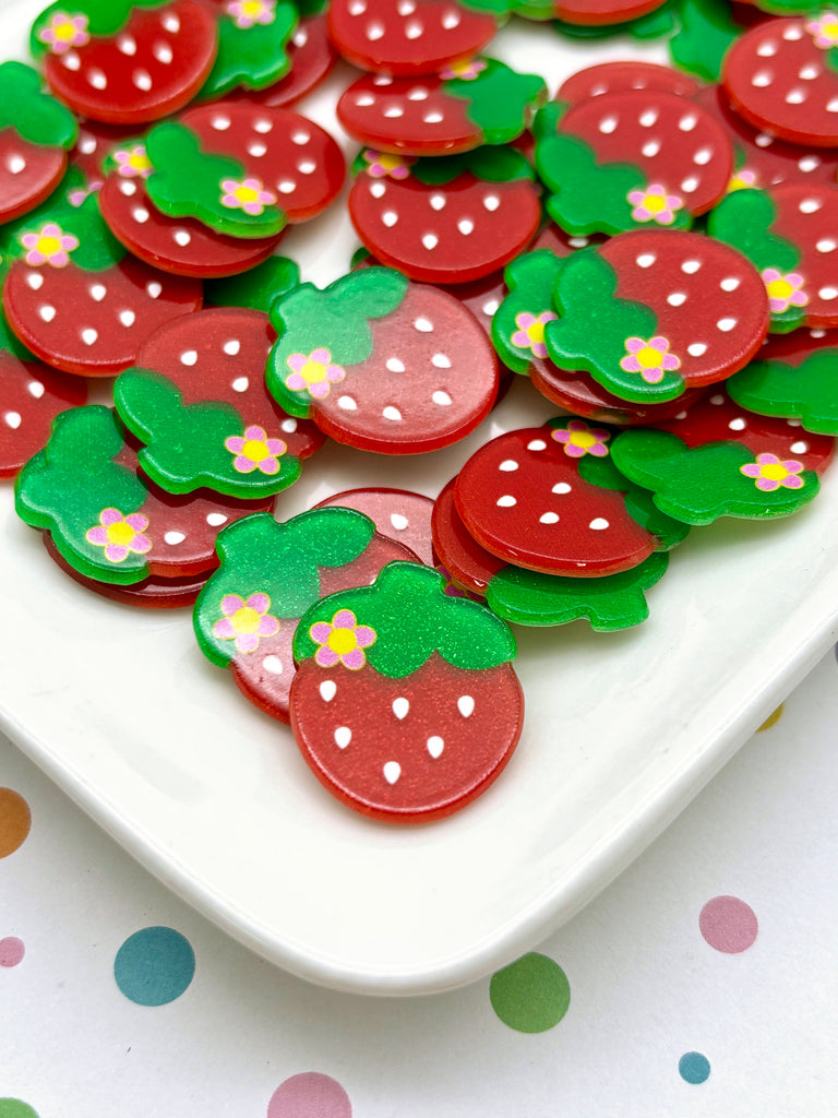 a white plate topped with lots of red and green cookies