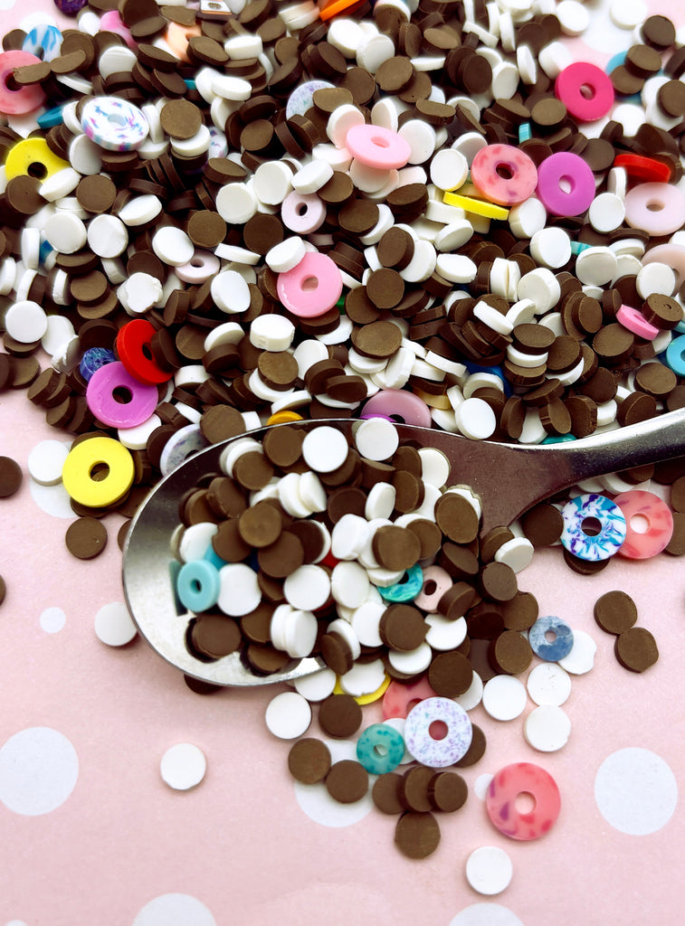 a spoon full of sprinkles on a table