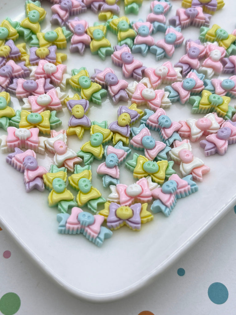 a white plate topped with lots of little bows