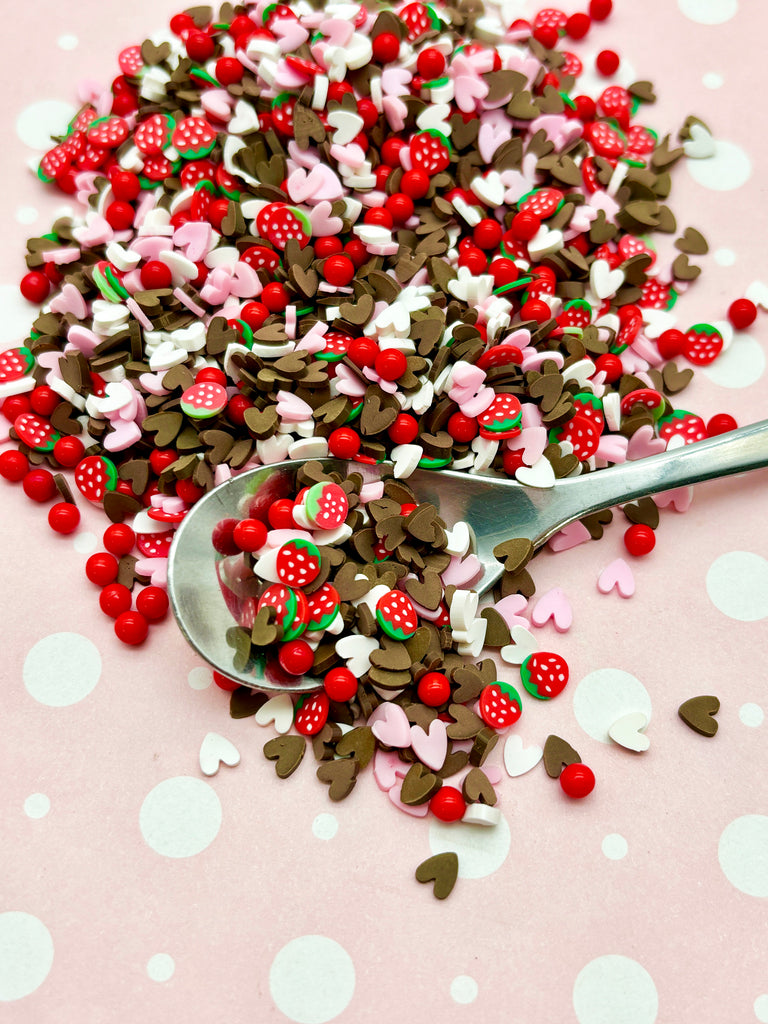 a spoon full of sprinkles on a table