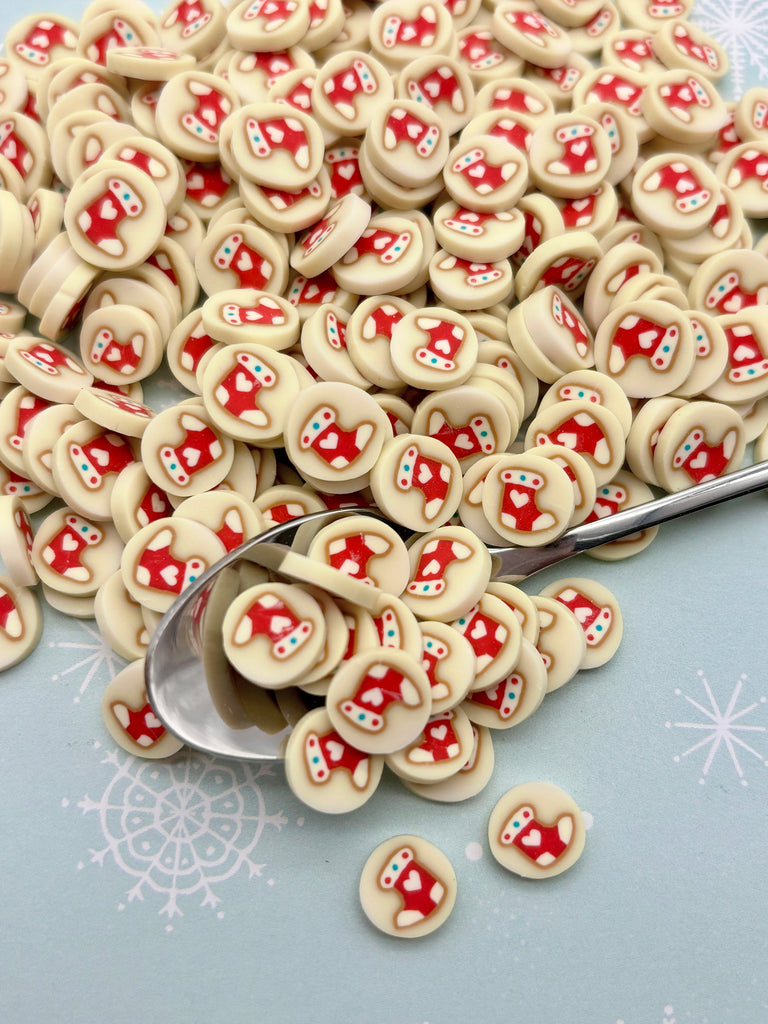 a spoon is sitting next to a pile of cookies