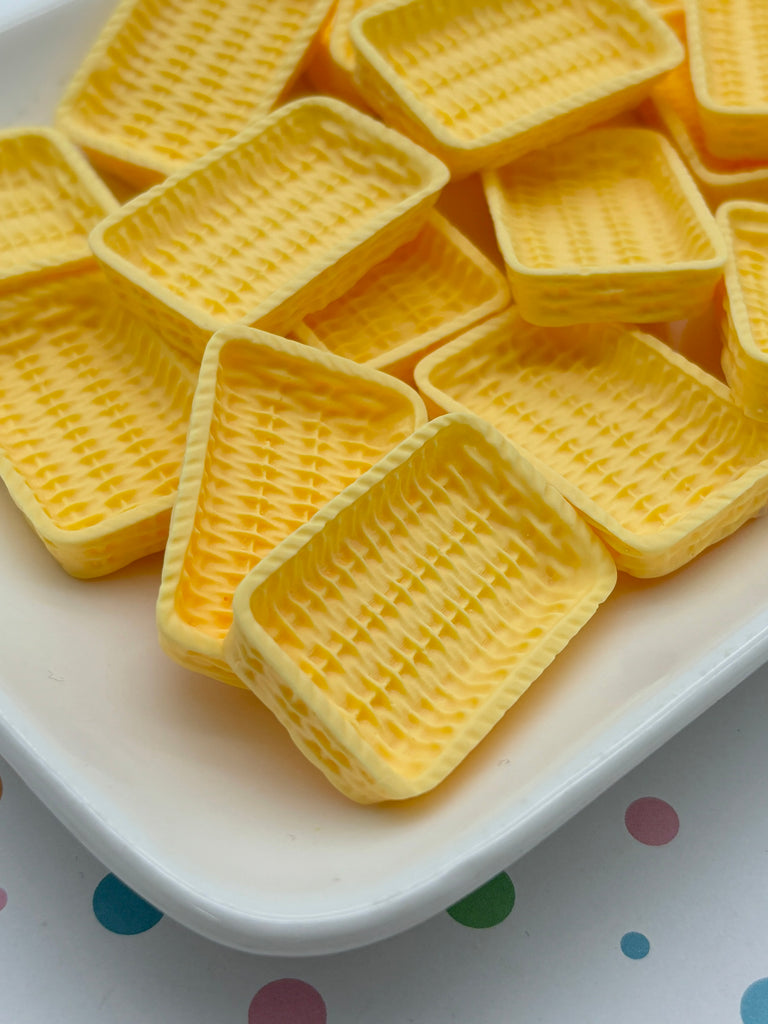 a white plate topped with waffles on top of a table