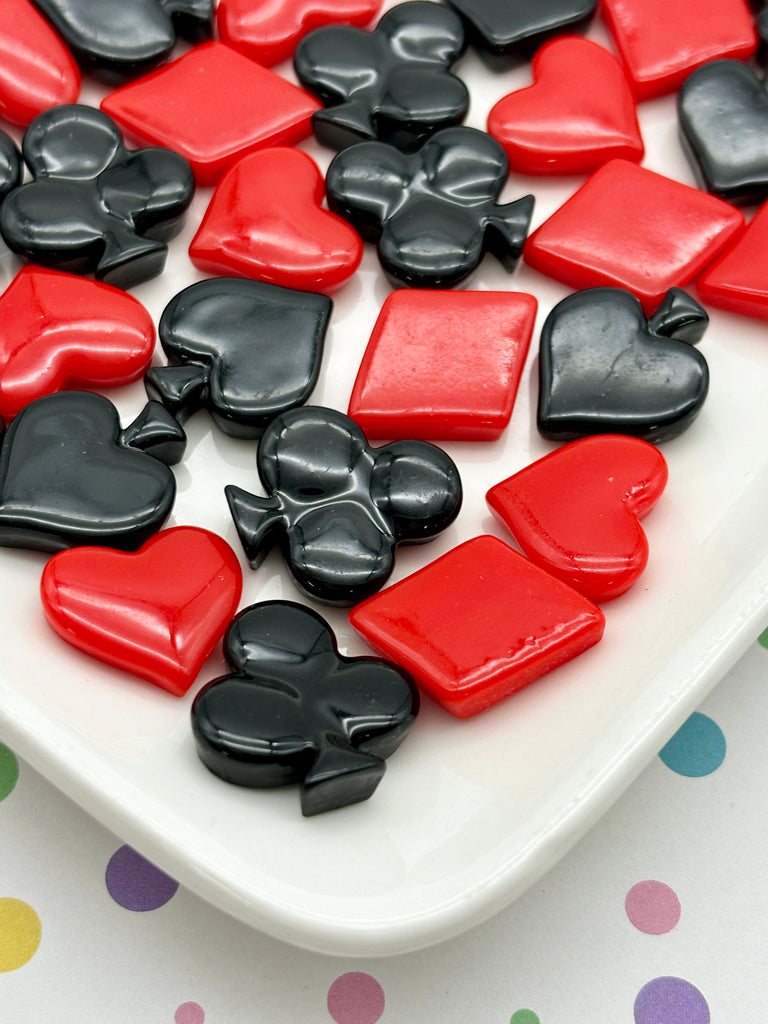 a white plate topped with lots of red and black hearts