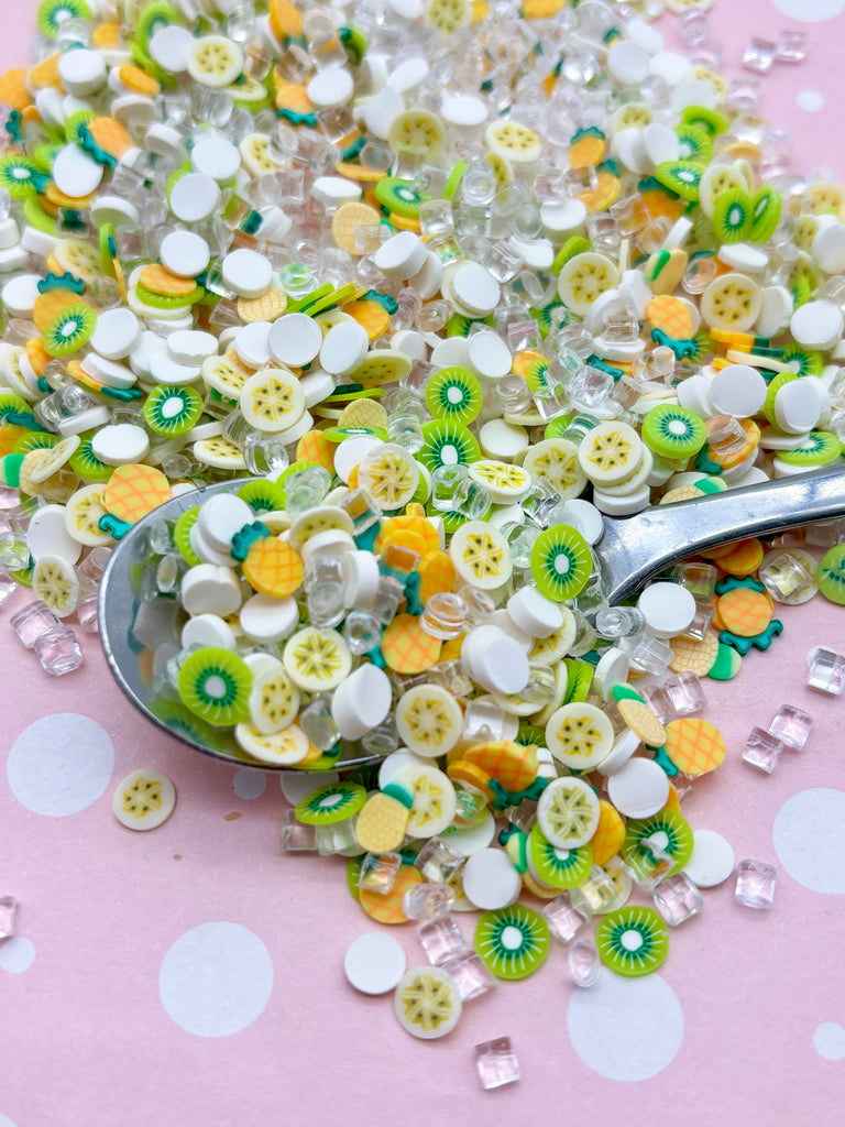 a spoon full of buttons sitting on top of a table