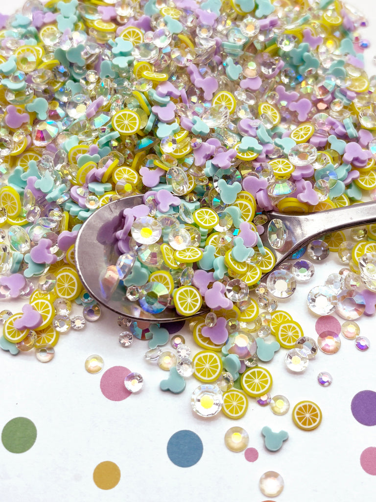 a spoon full of sequins and a pile of confetti