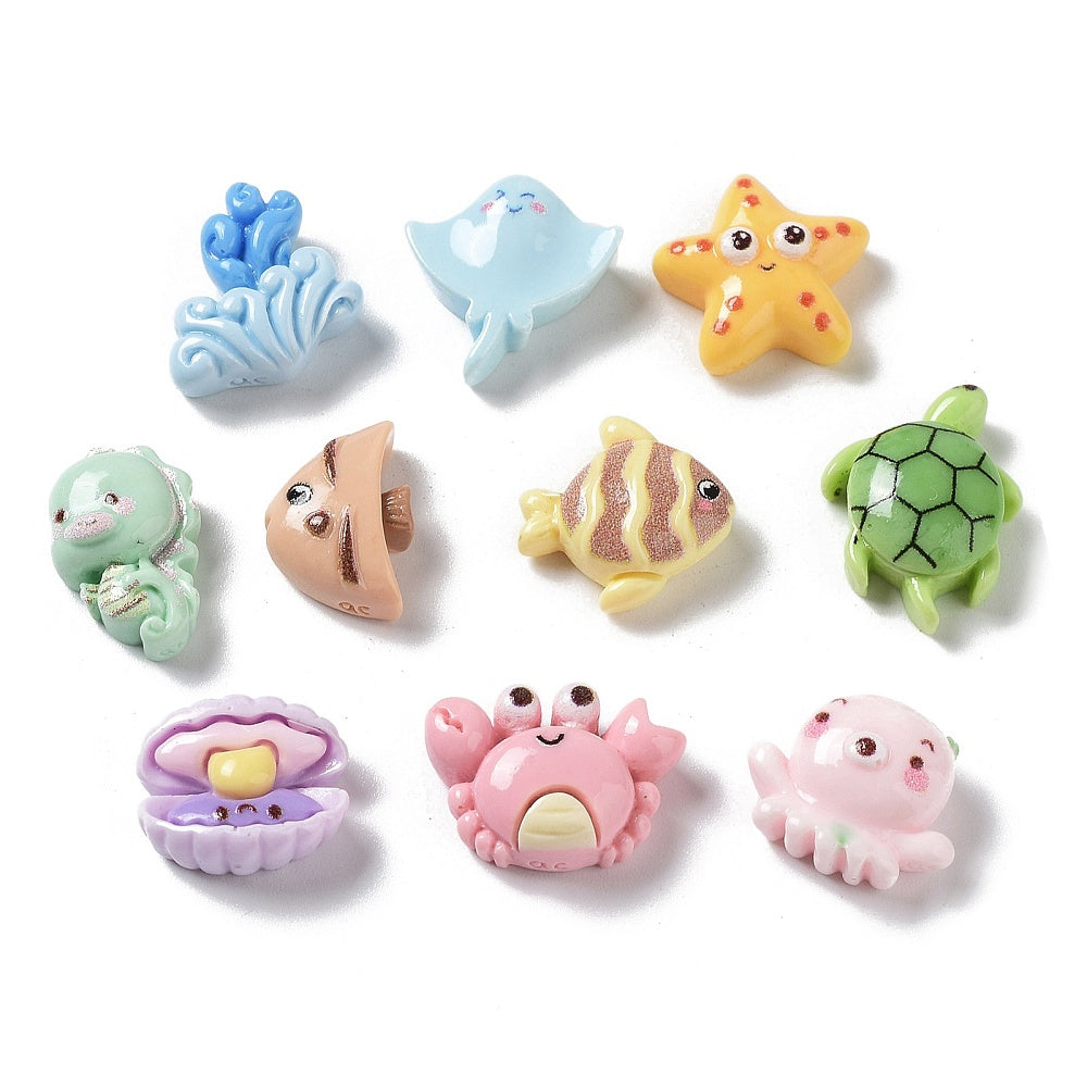 nine colorful sea animal figurines, including a blue fish, a yellow starfish, a green turtle, a brown and yellow striped fish, a pink crab, a purple shell, and a pink octopus.