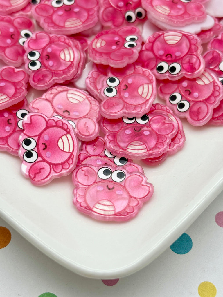 a white plate topped with lots of pink teddy bears