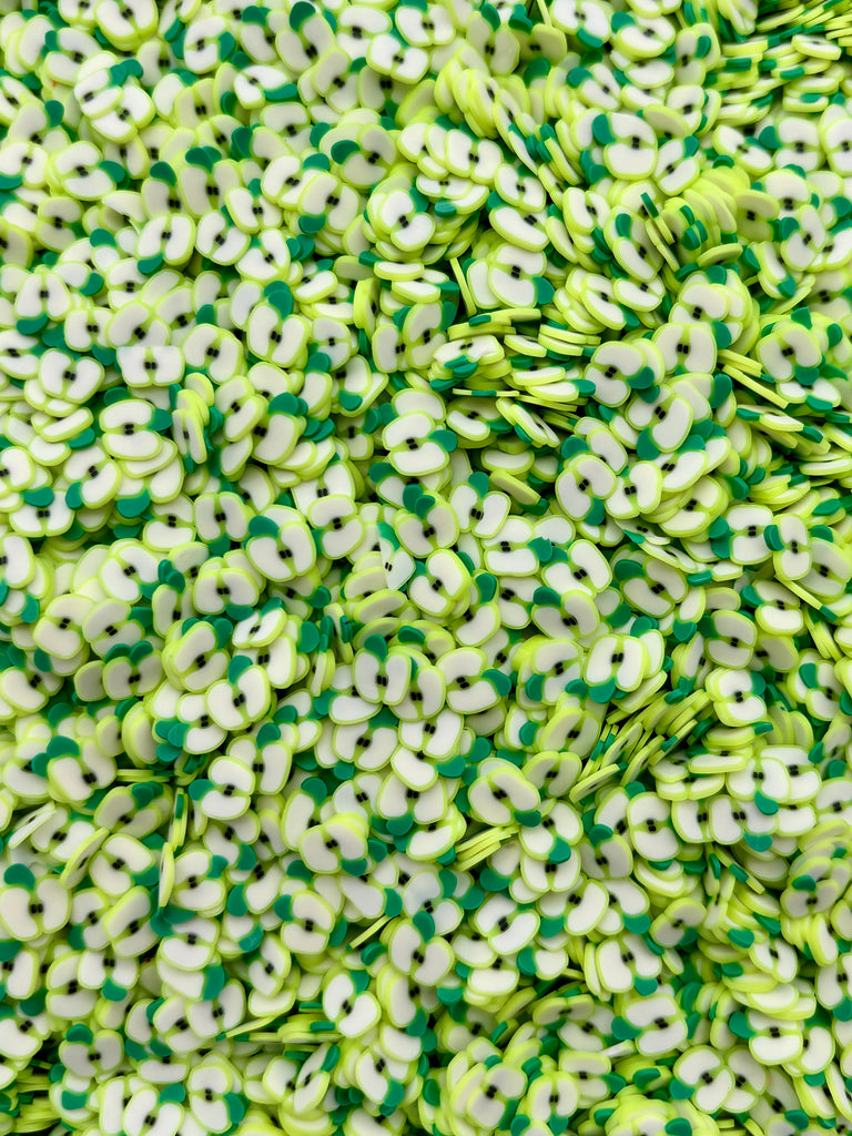 a pile of green and white sprinkles