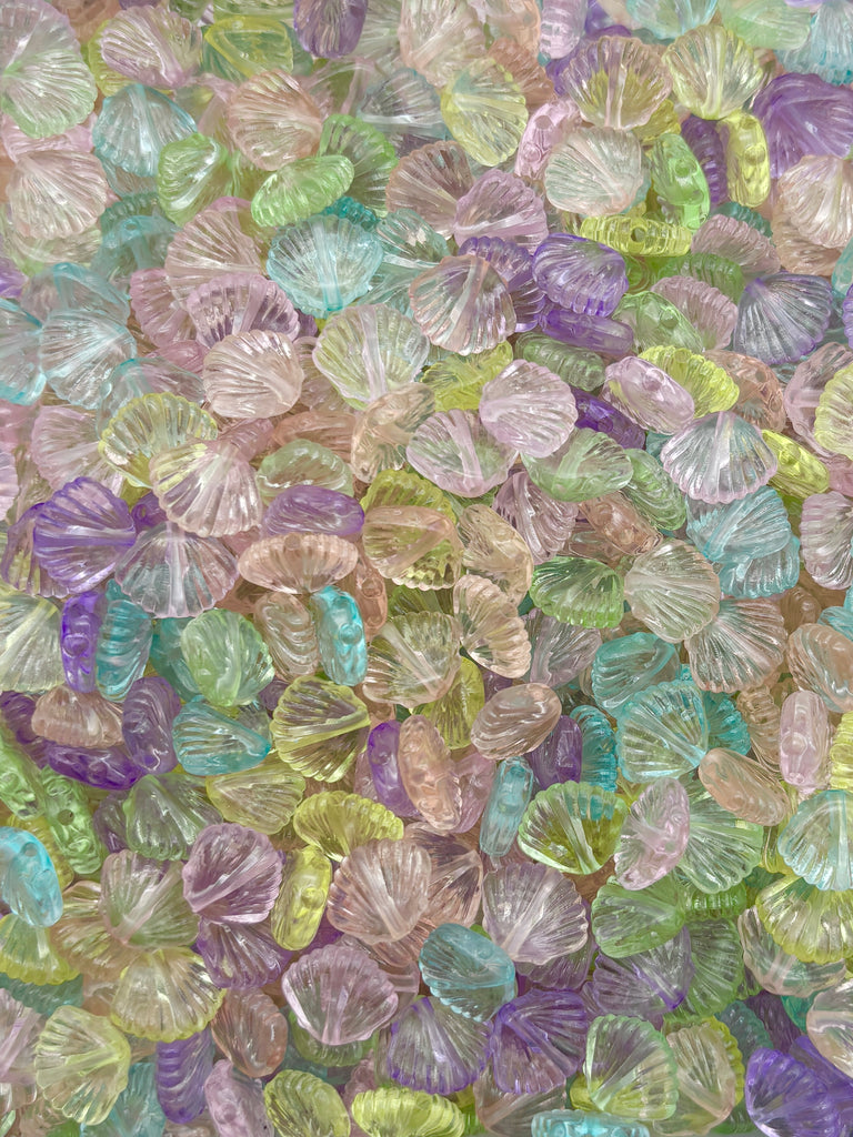 The image is a vibrant and colorful collage of various glass beads in different shapes, sizes, and hues, creating a visually striking and diverse display.