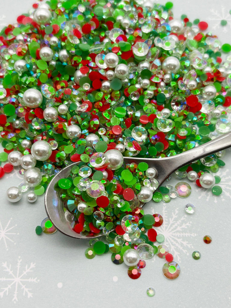 a spoon full of green and red sprinkles