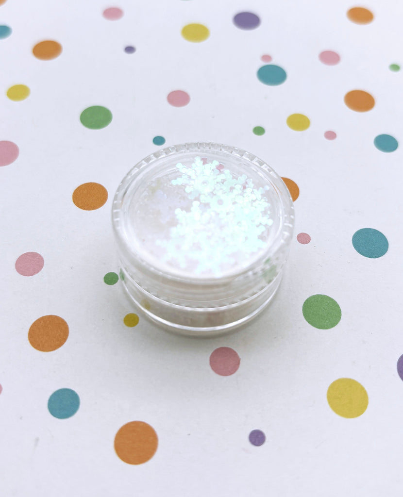 a small jar of white powder on a polka dot tablecloth