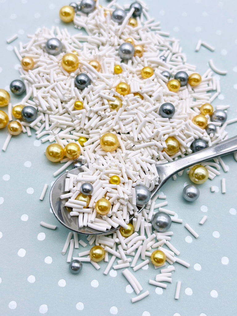 a spoon full of sprinkles on a table