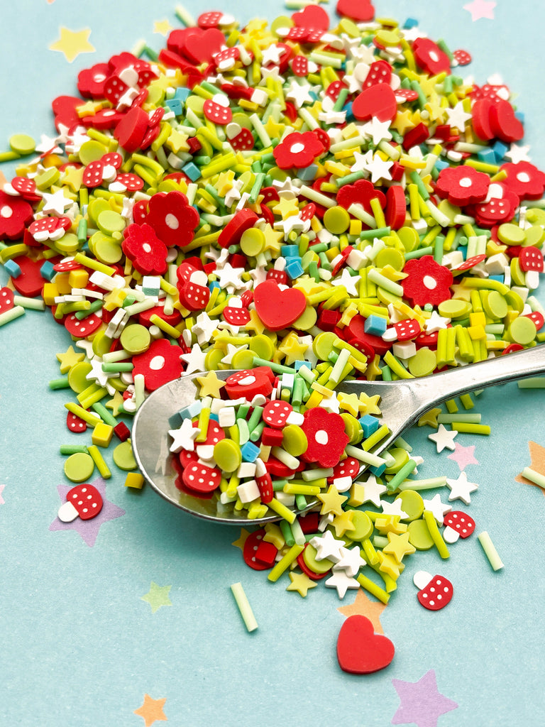 a spoon full of sprinkles on a table