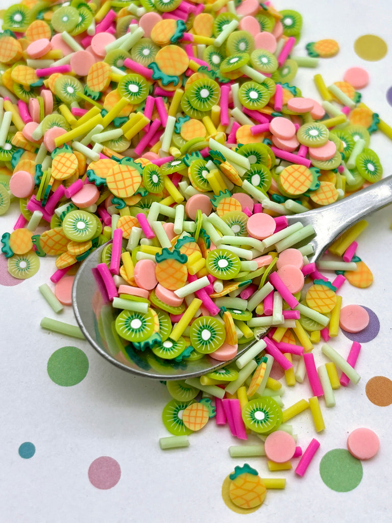 a spoon filled with lots of colorful candies