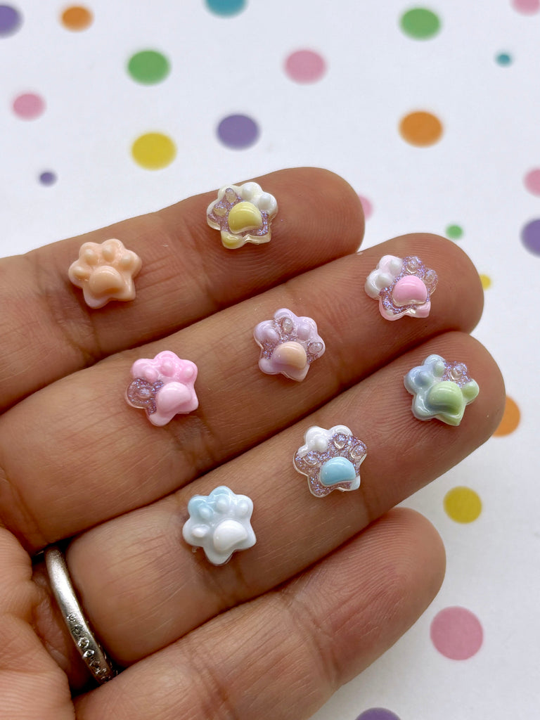 a person is holding a bunch of small flowers