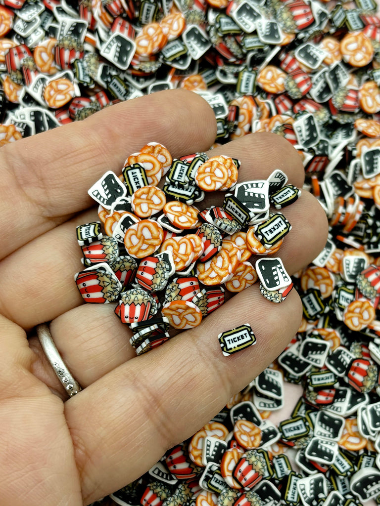 a person is holding a bunch of colorful beads