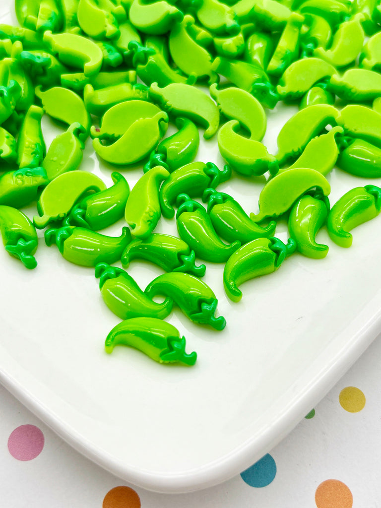 a white plate topped with green slim beans