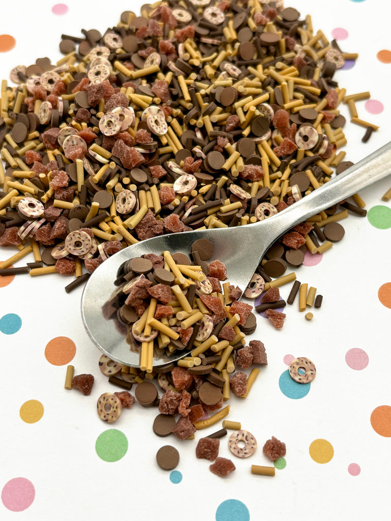 a spoon full of dog food on a polka dot tablecloth