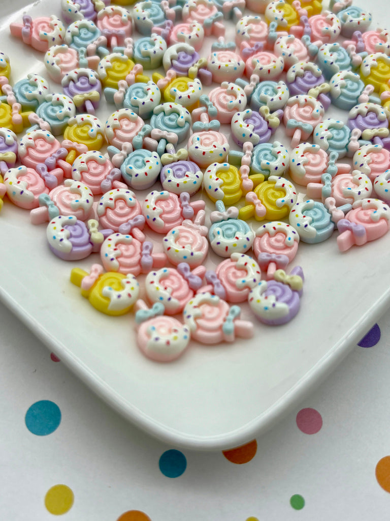 a white plate topped with lots of colorful beads